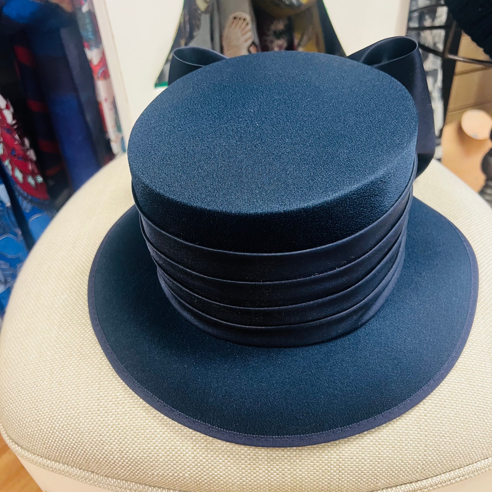 Classic navy fabric special occasion hat with large bow