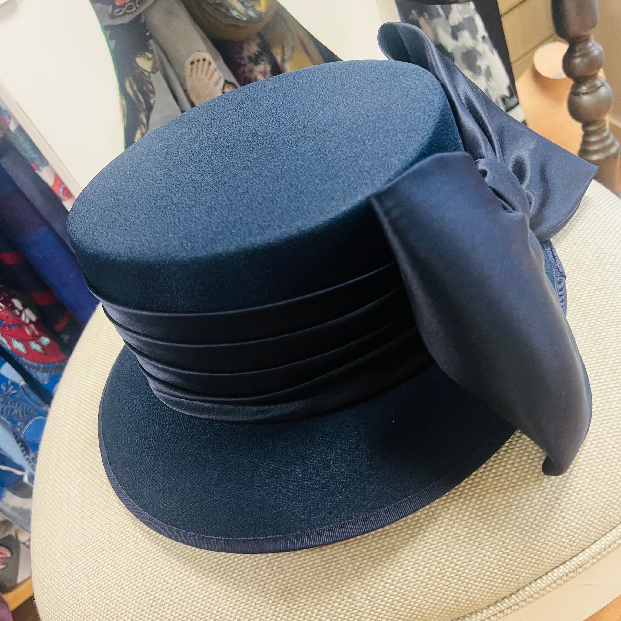 Classic navy fabric special occasion hat with large bow