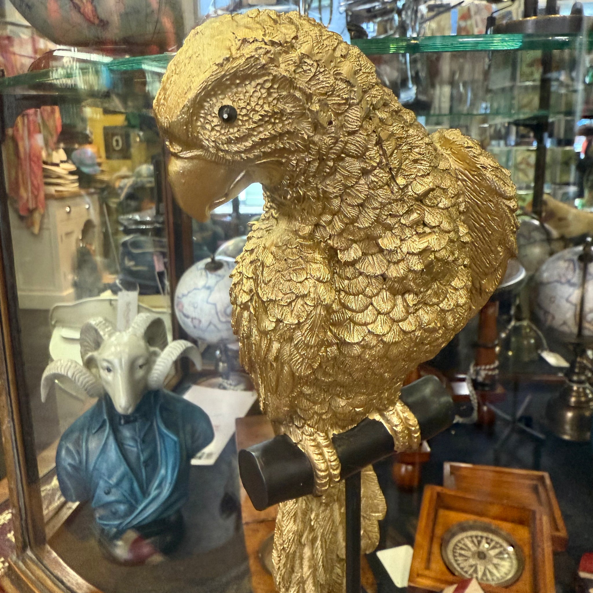 Gilded Parrot on Black Stand