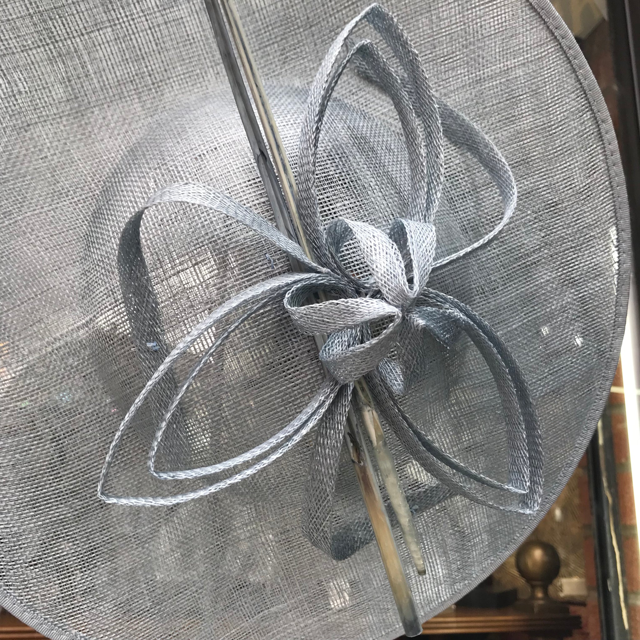Sinamay round fascinator with long feather