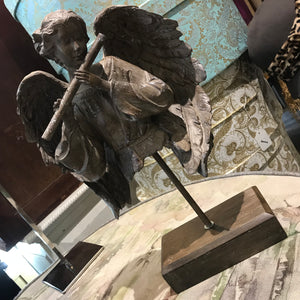Angel torso playing flute 