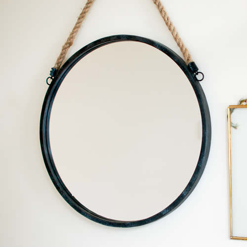 Round large black mirror on rope