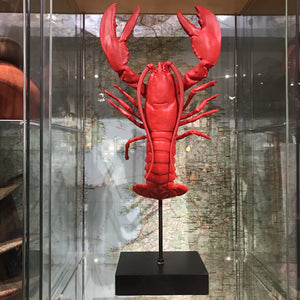 Red faux lobster on stand