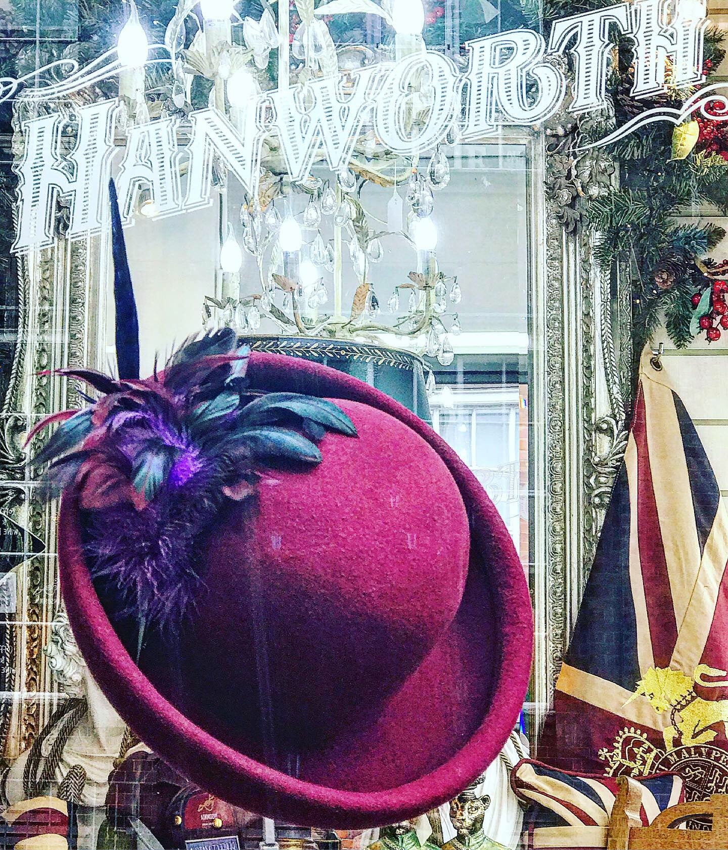 Maroon rolled brim Cloche with feather corsage