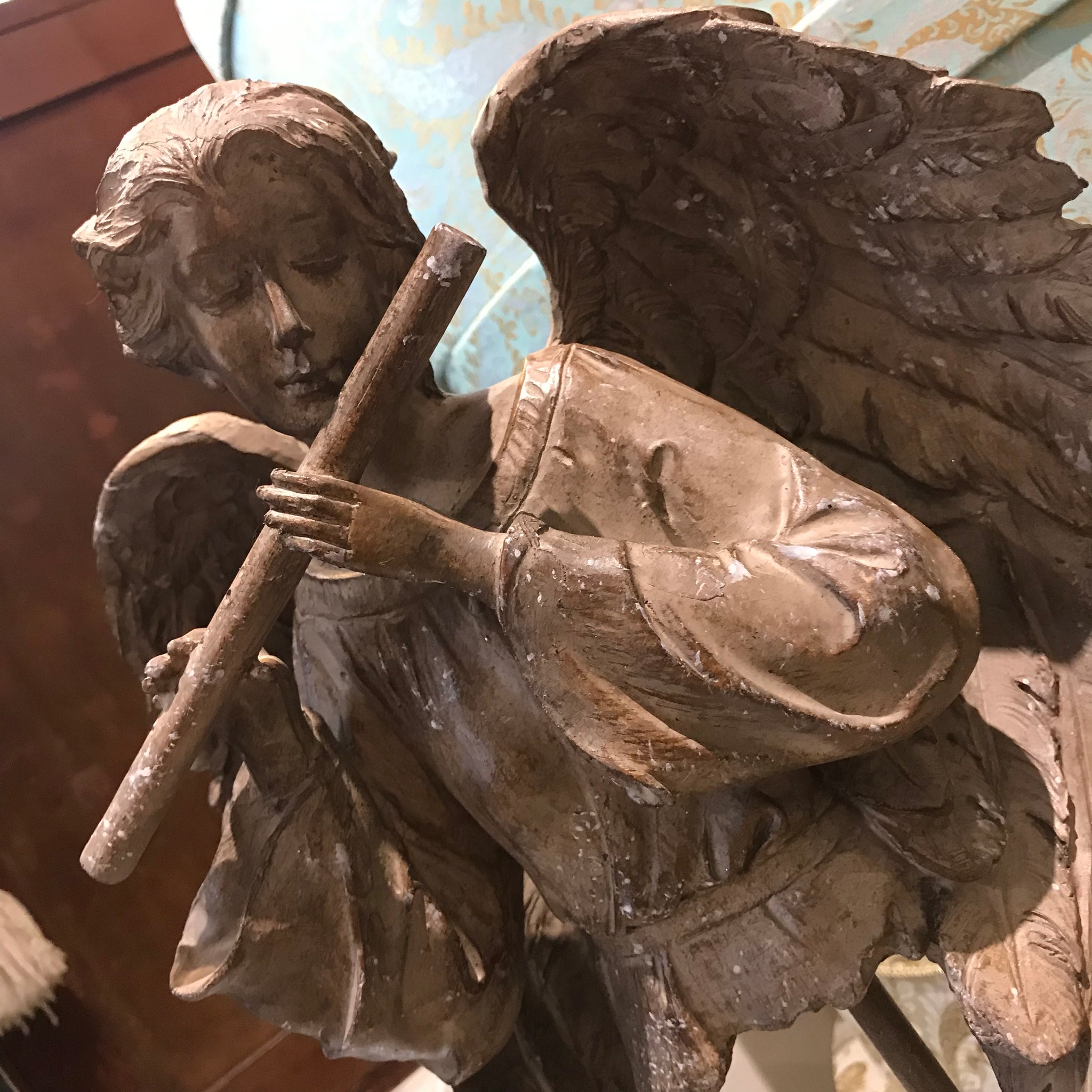 Angel torso playing flute 
