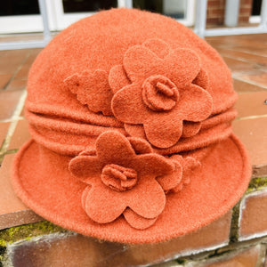 A Cosy Wool Cloche Hat With Flower