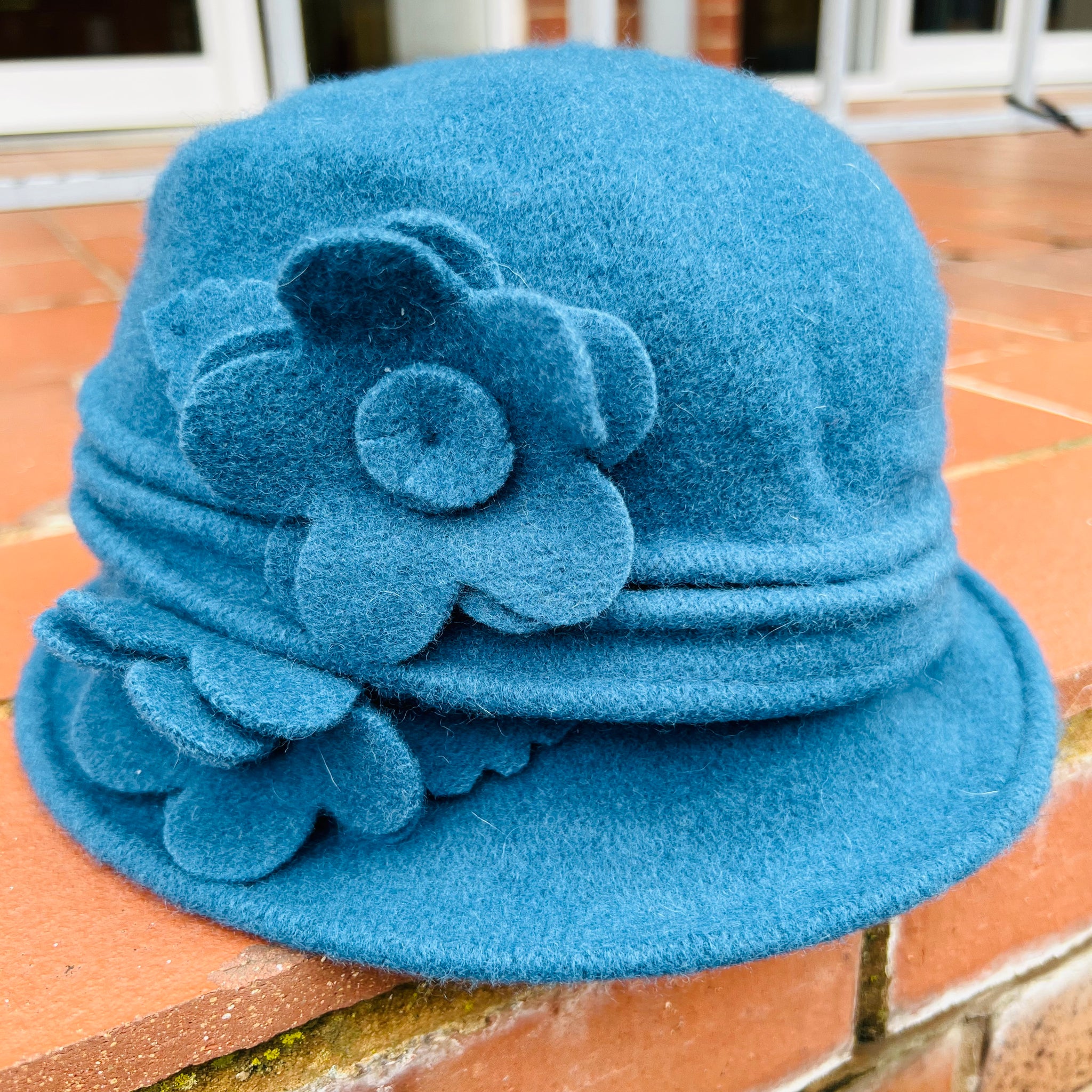 A Cosy Wool Cloche Hat With Flower