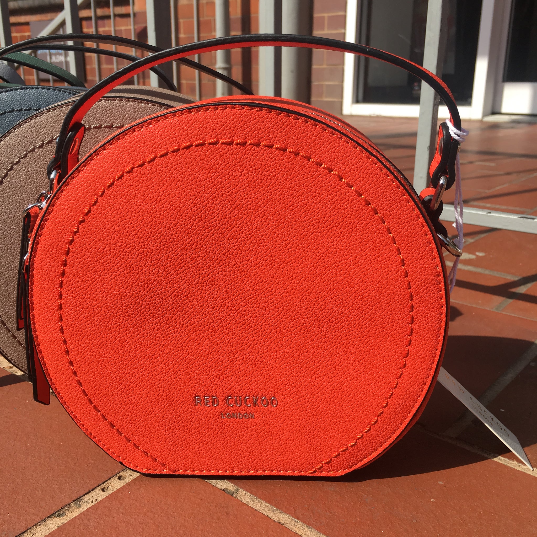 Red Cuckoo round shoulder grab bag