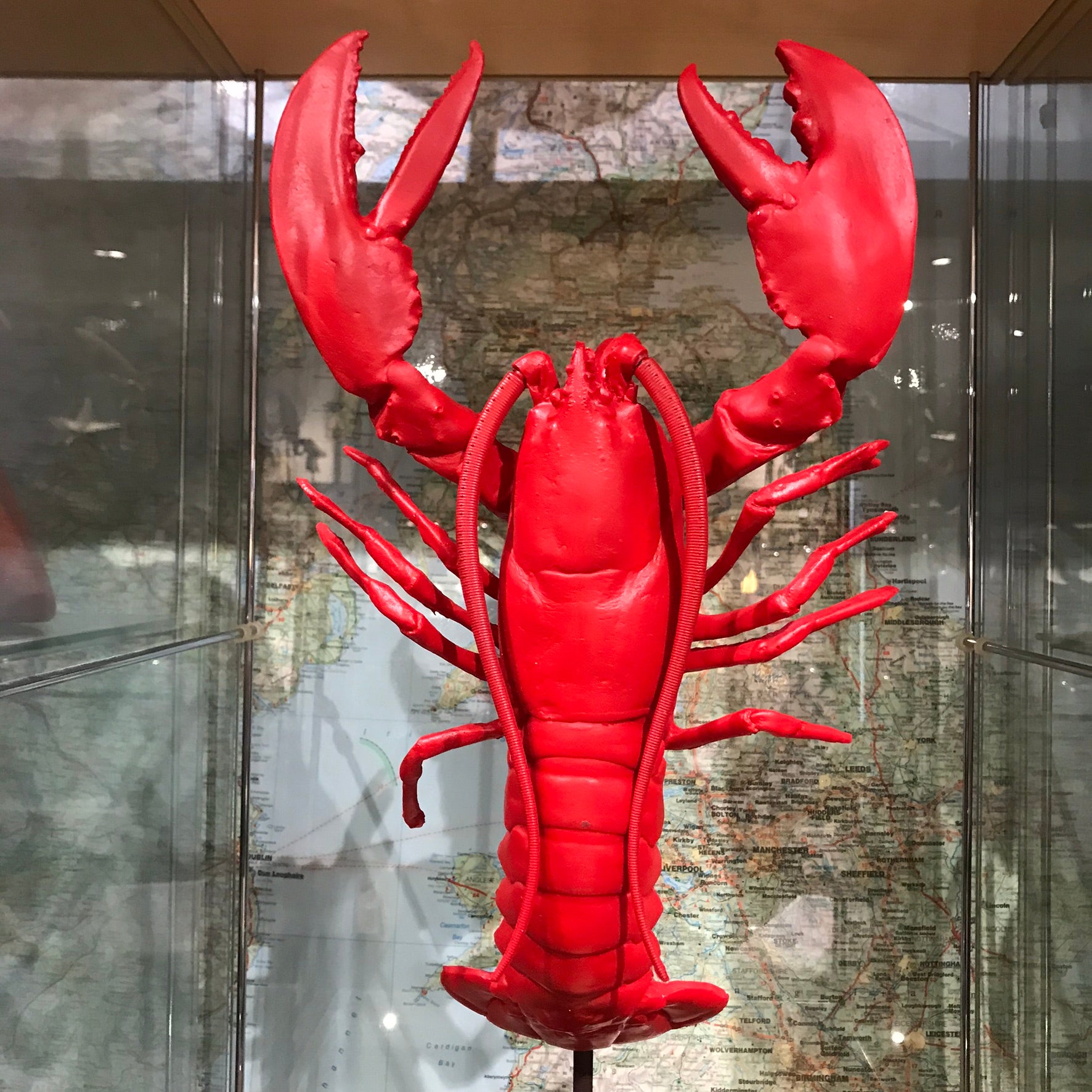 Red faux lobster on stand