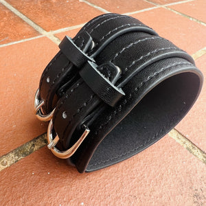 Black wrist cuff with double buckle